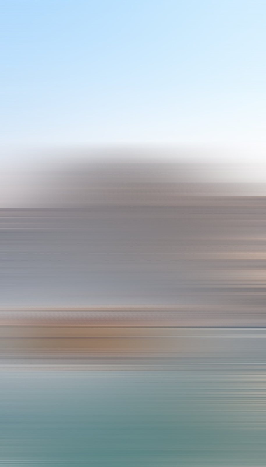 An abstract motion blur in pale sky and teal